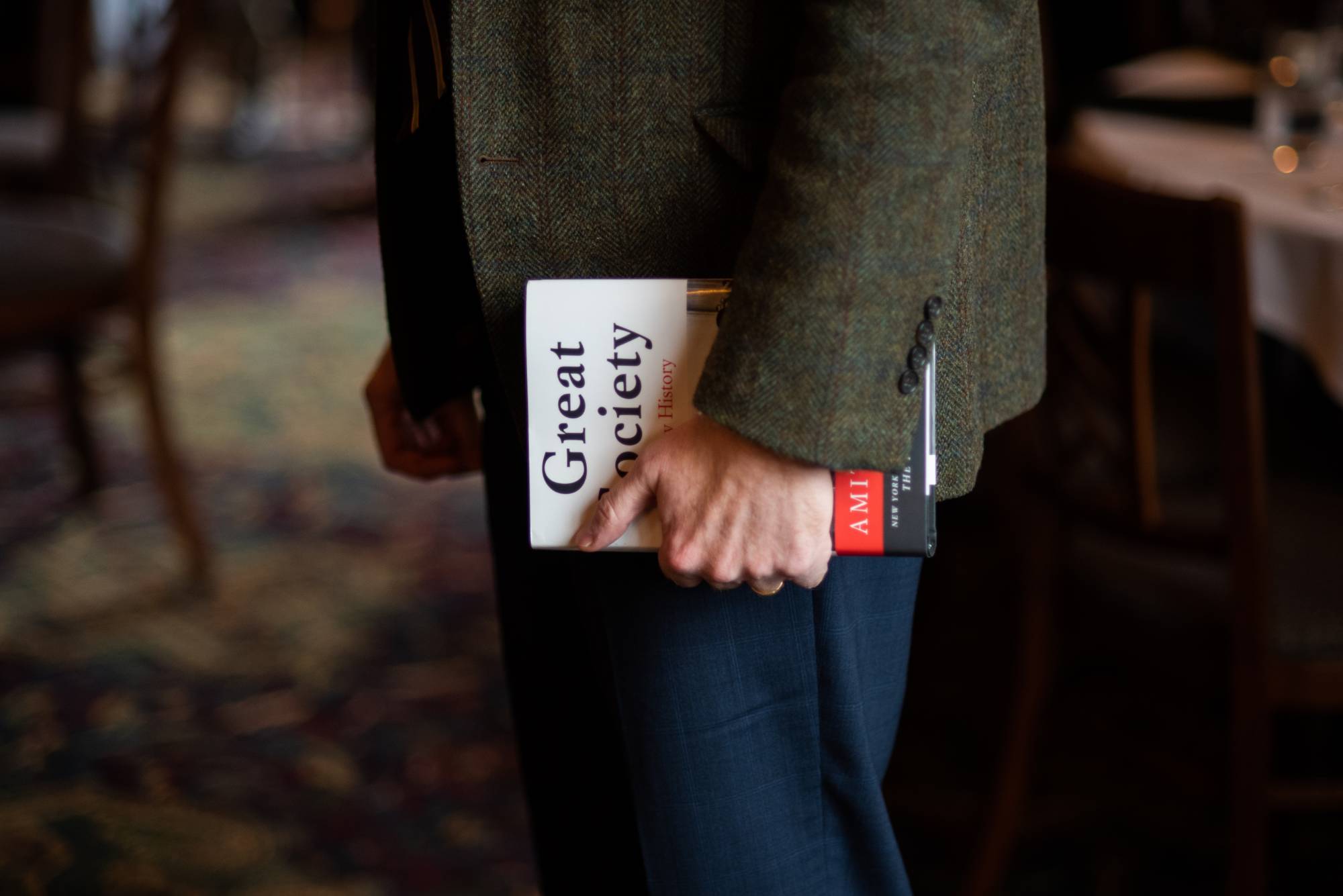 attendee holding book